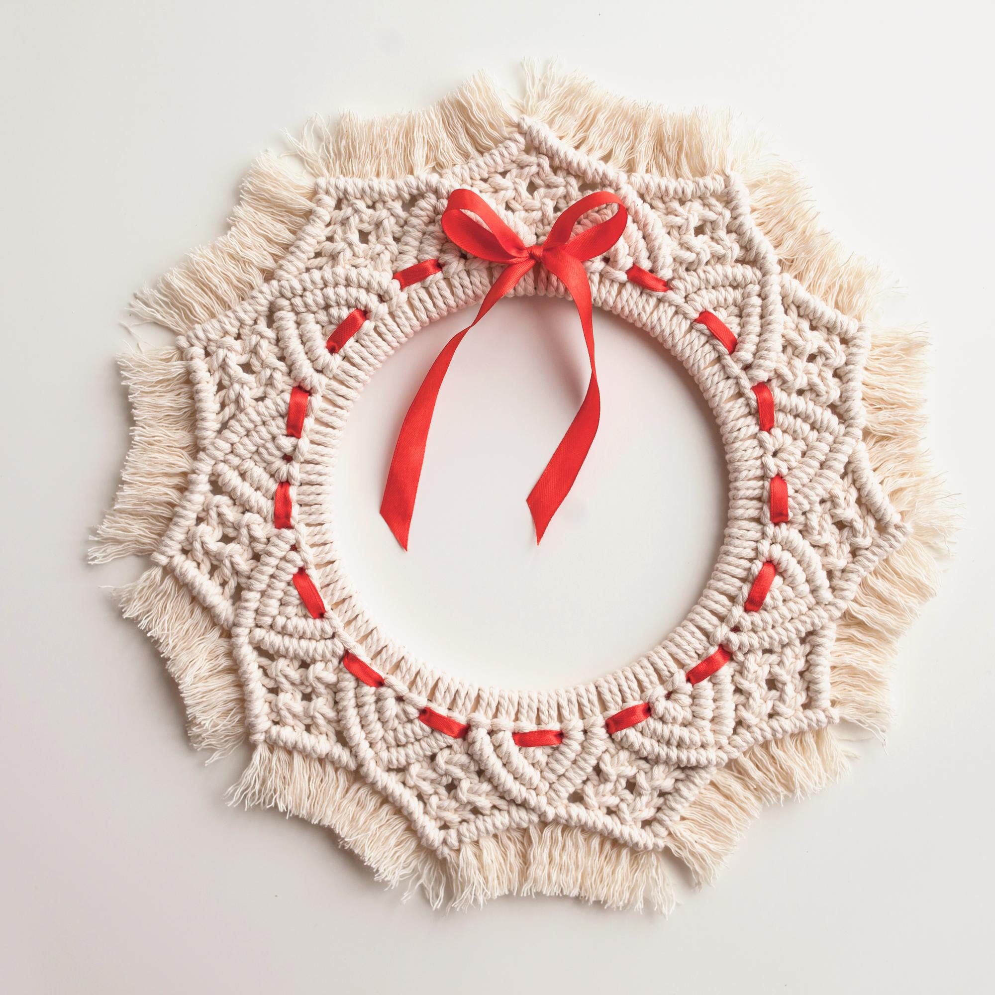 Circular composition of embroidered motifs on linen