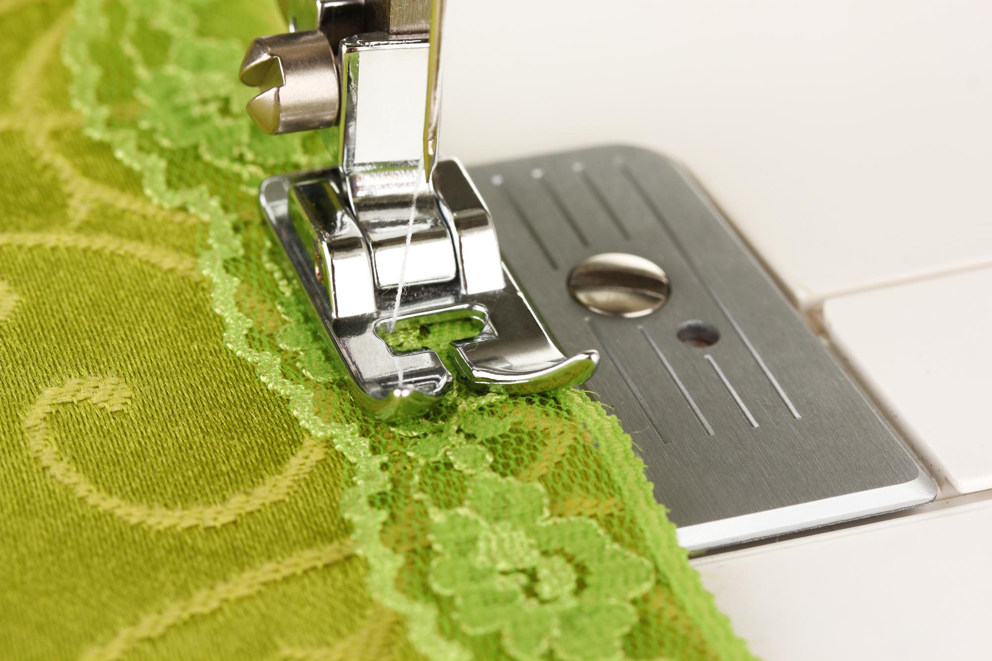 Garment hem finished with embroidered band